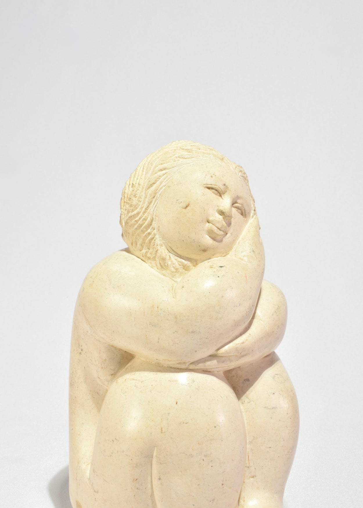 Seated Female Figure Sculpture