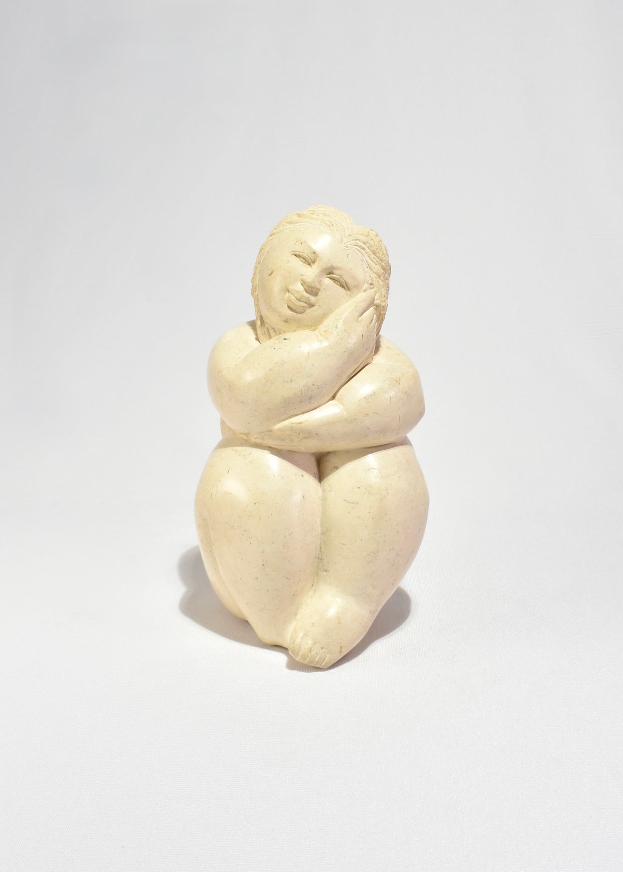 Seated Female Figure Sculpture