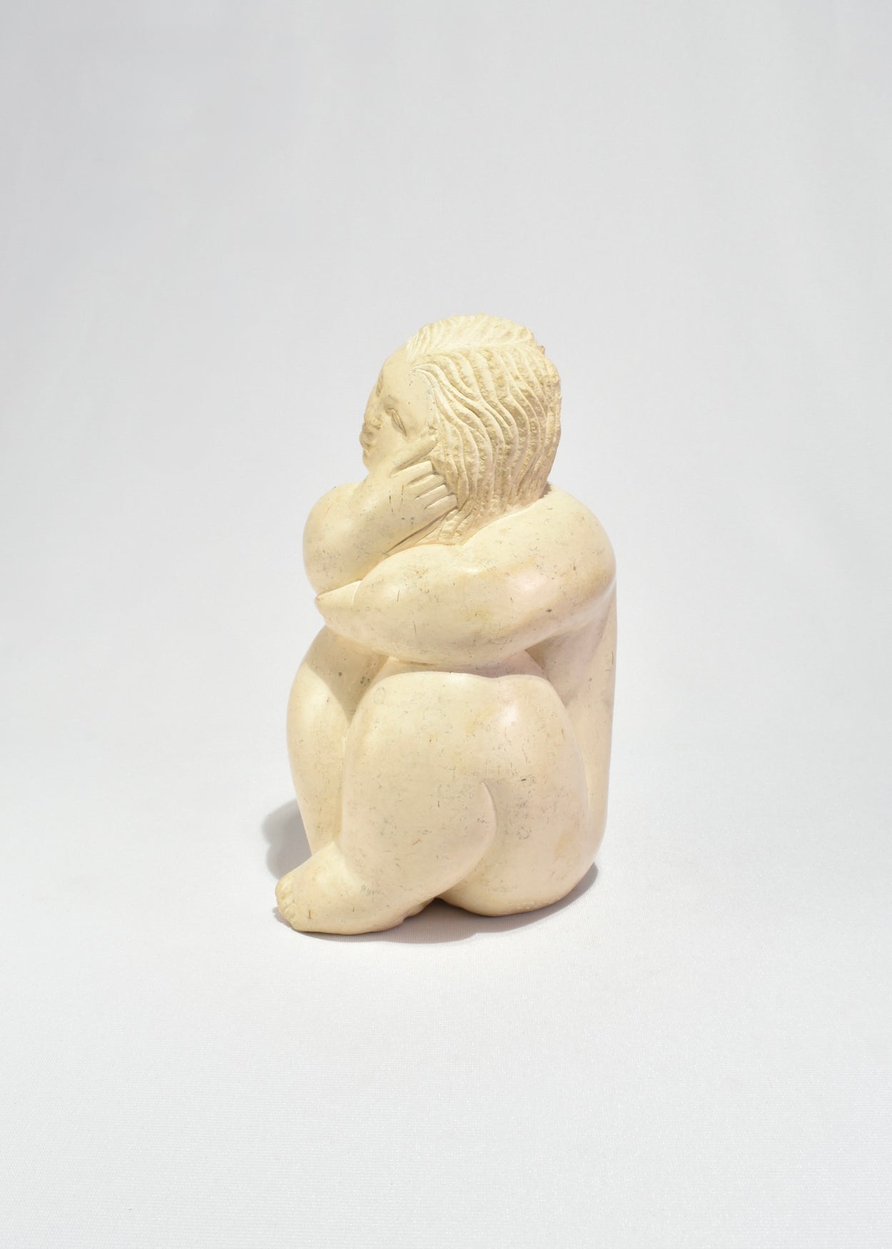 Seated Female Figure Sculpture