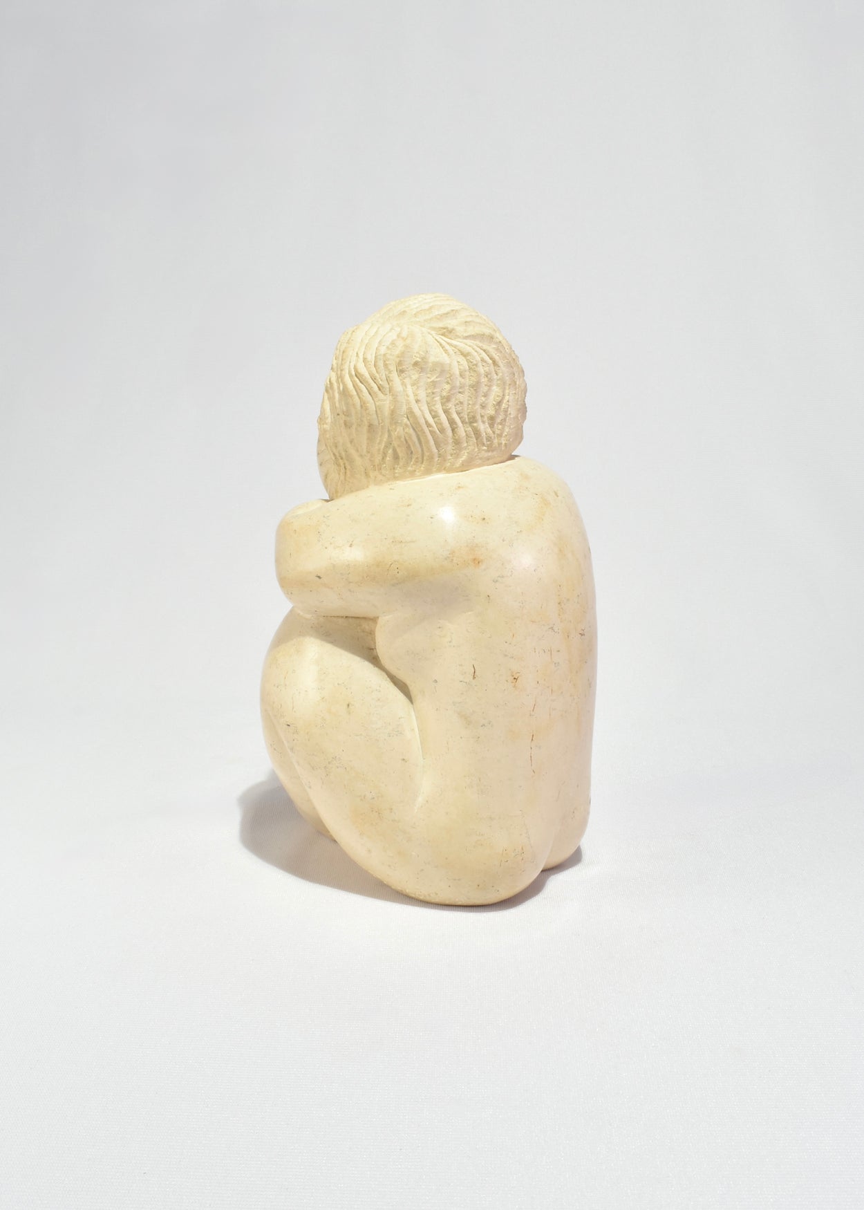 Seated Female Figure Sculpture