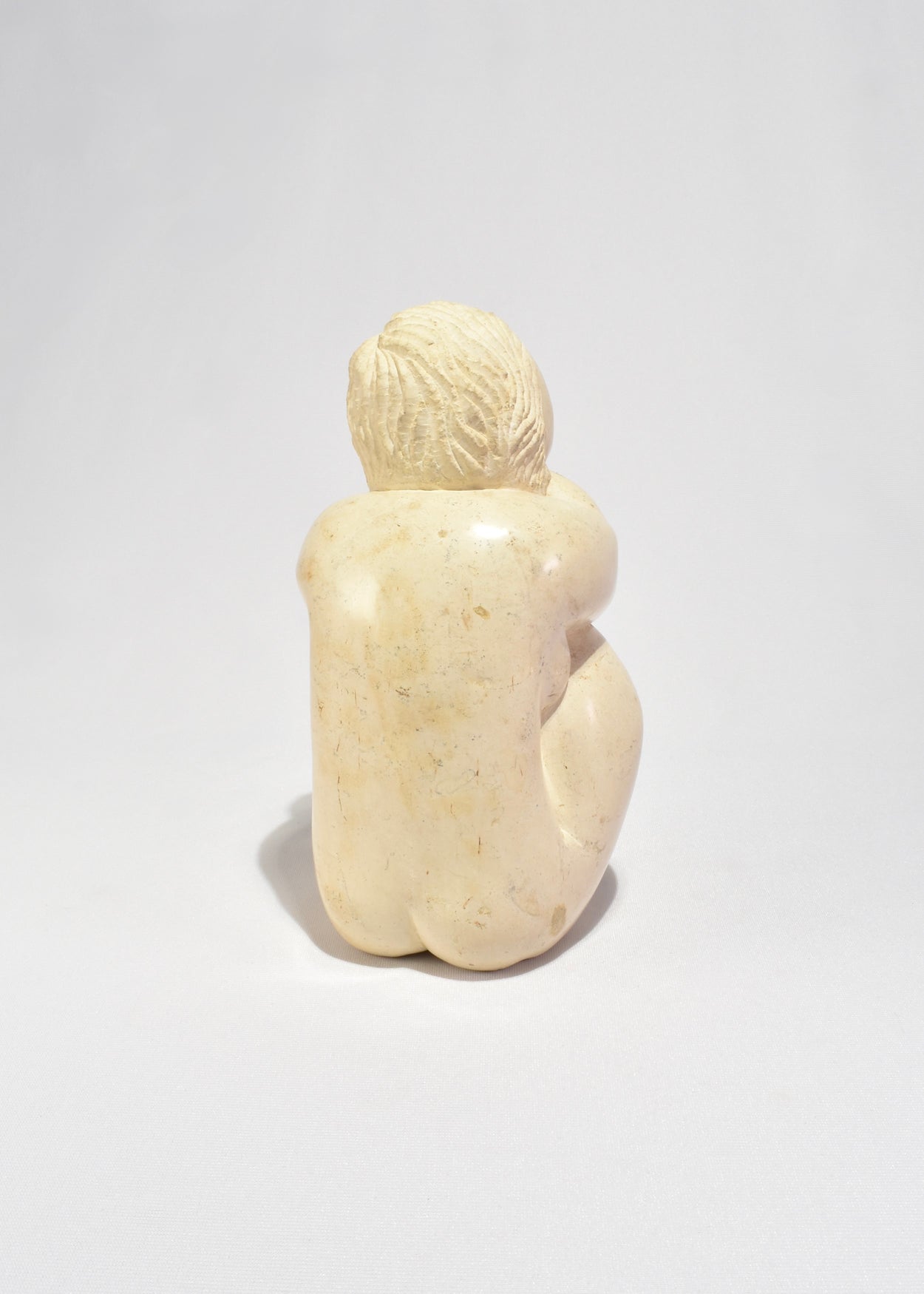 Seated Female Figure Sculpture