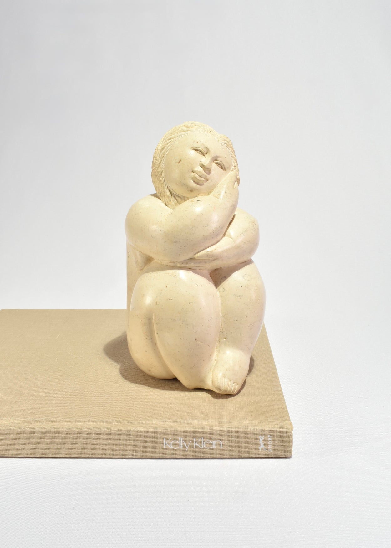 Seated Female Figure Sculpture
