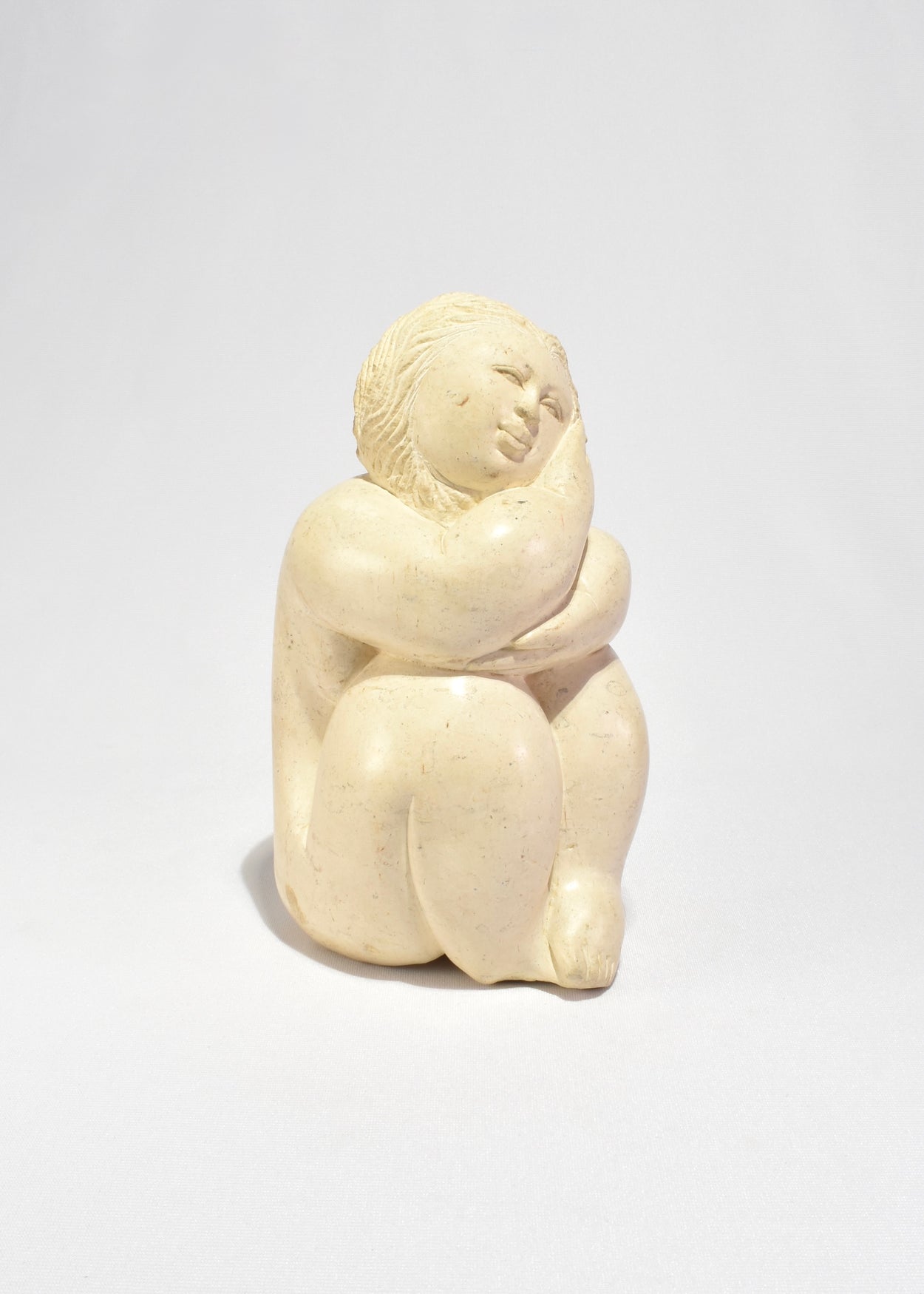 Seated Female Figure Sculpture