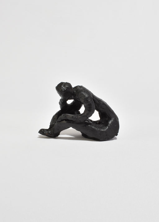 Seated Figure Sculpture