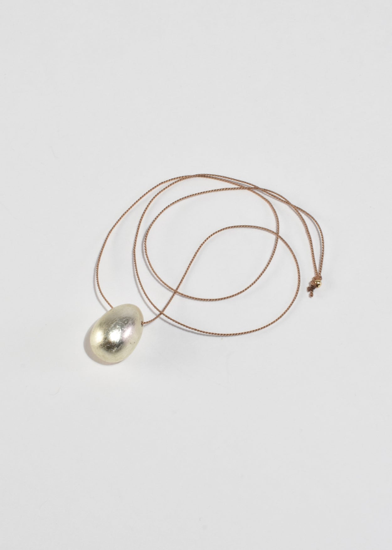 Silver Egg Necklace on Silk Cord