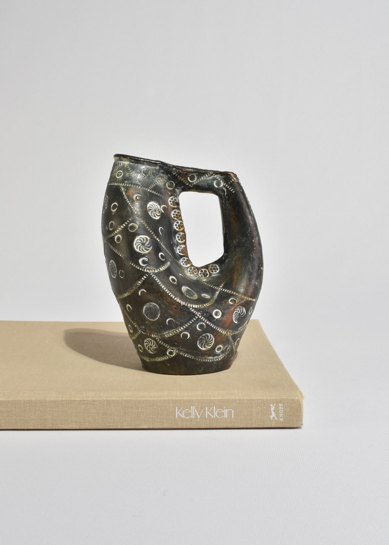 Hand-Carved Arched Vessel