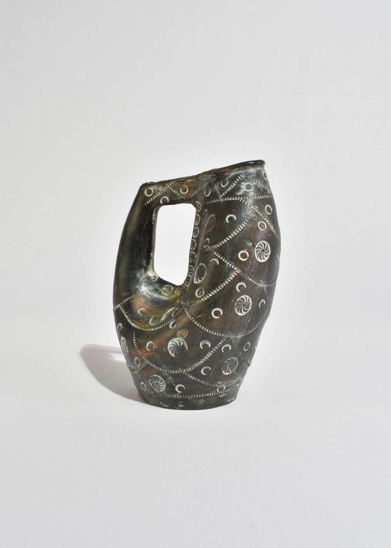 Hand-Carved Arched Vessel