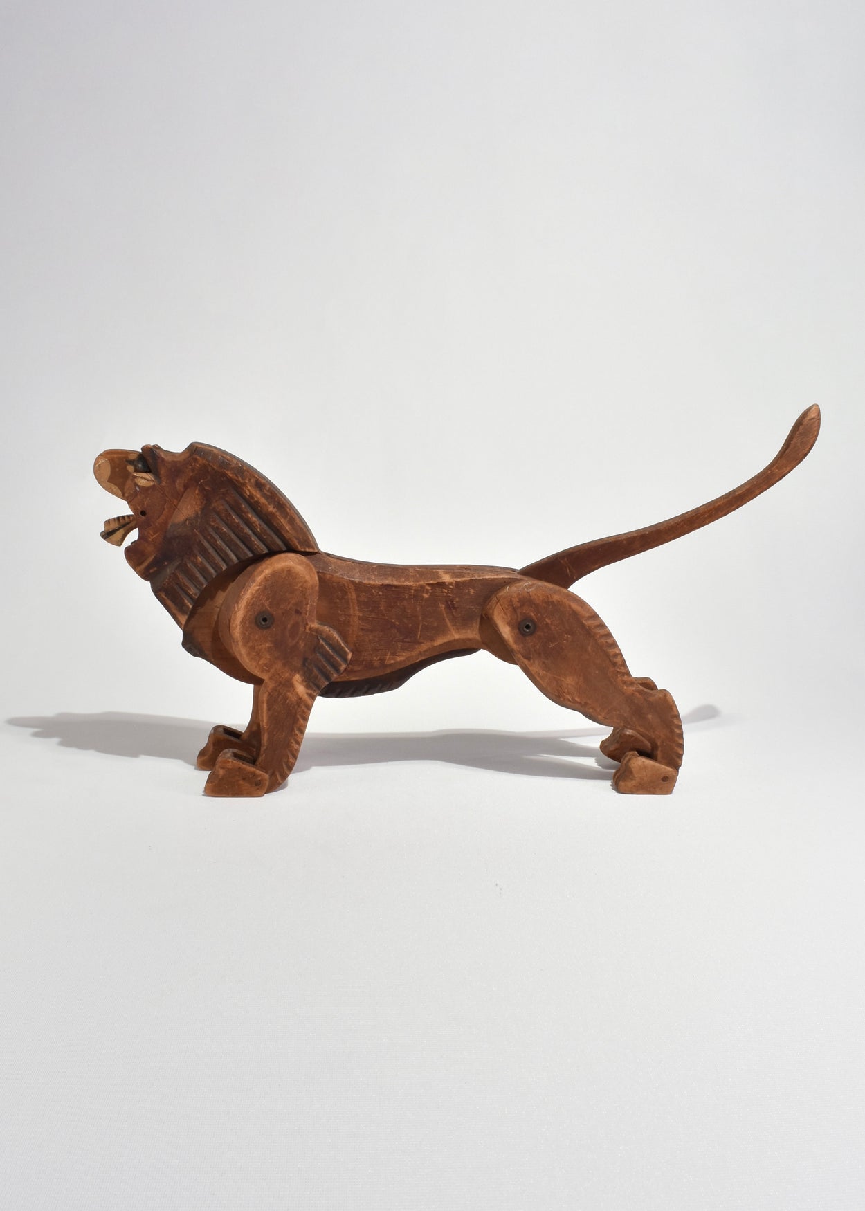 Hand-Carved Articulated Lion Sculpture