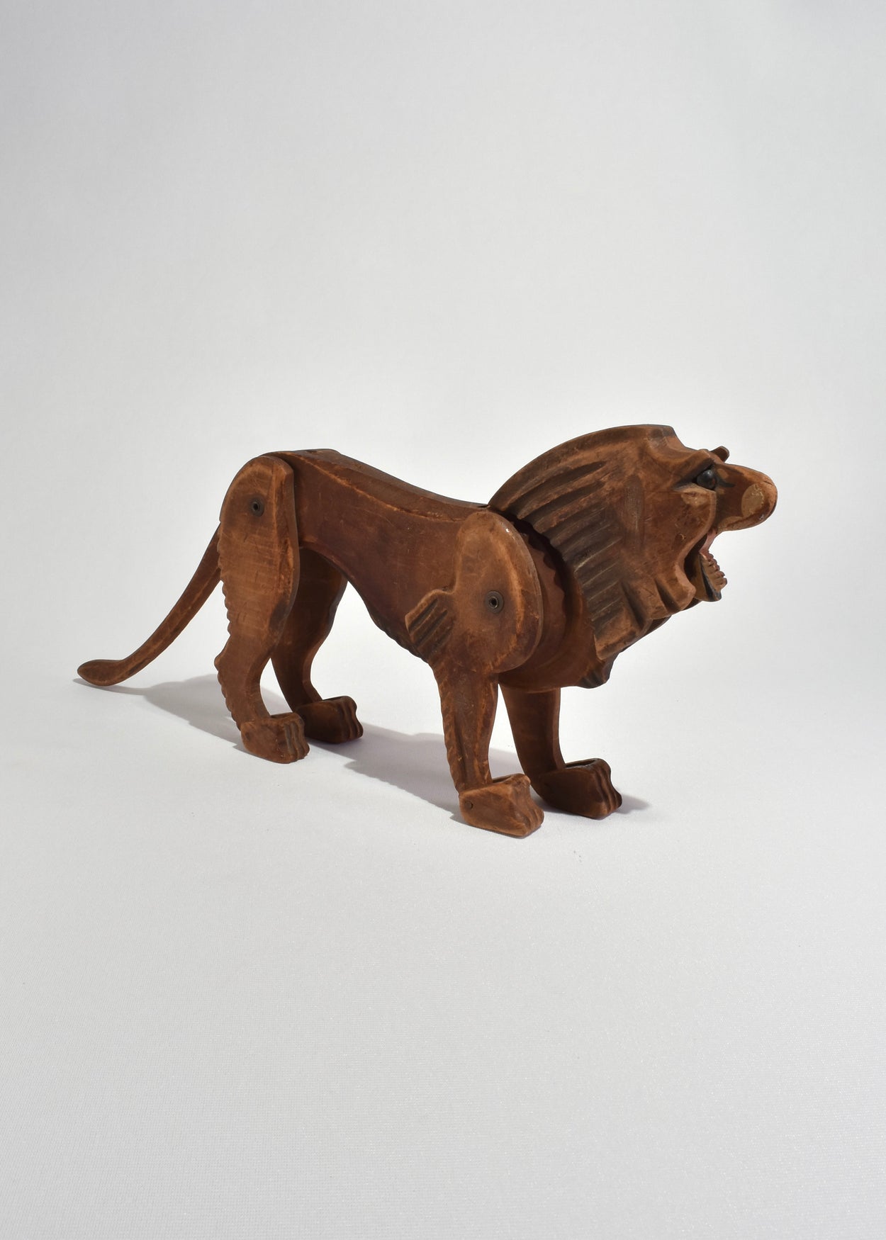 Hand-Carved Articulated Lion Sculpture