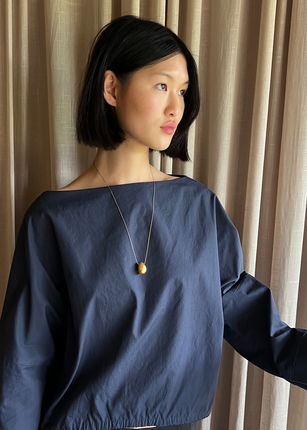 Gold Egg Necklace on Silk Cord