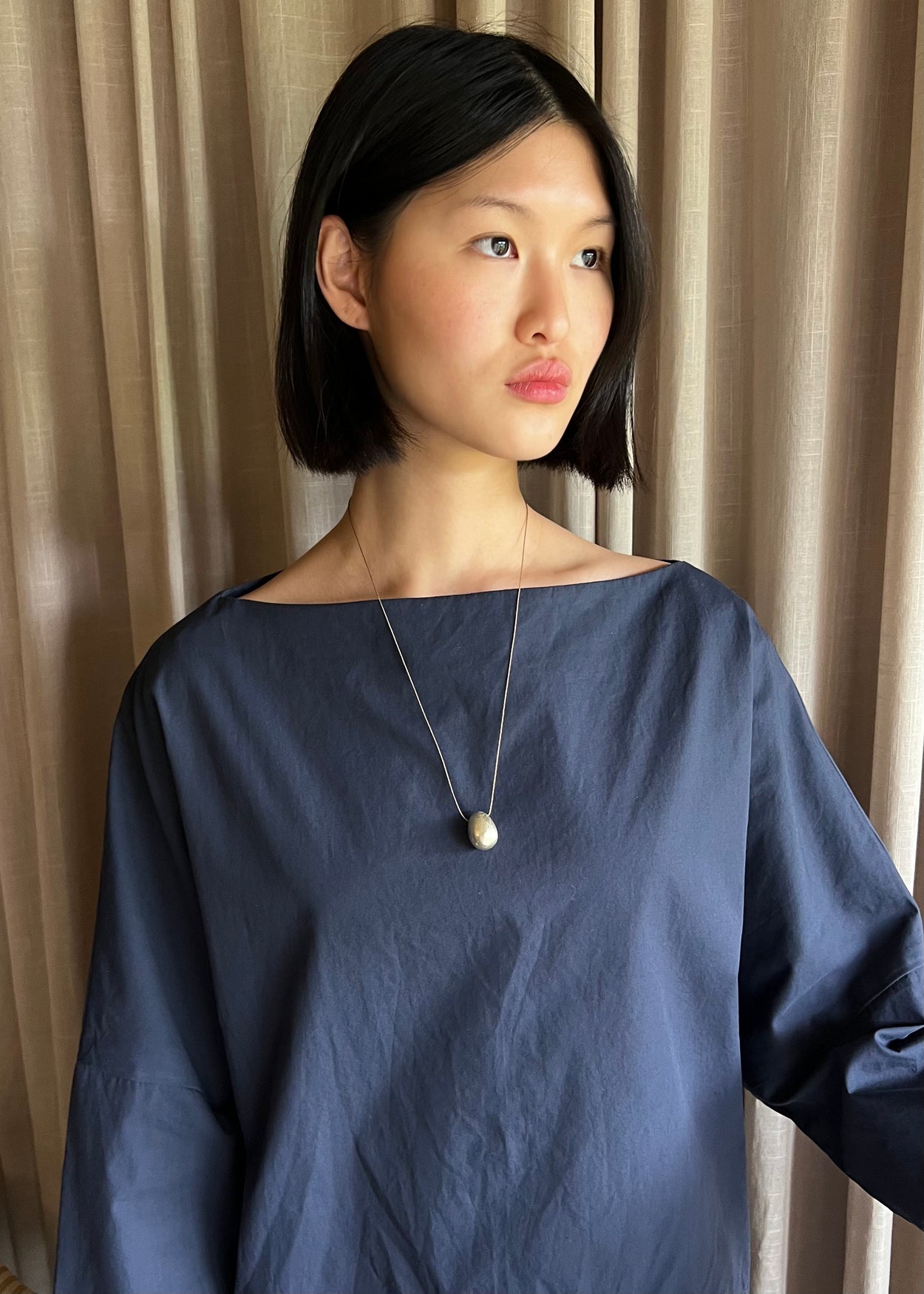 Silver Egg Necklace on Silk Cord
